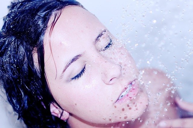 woman washing hair in shower