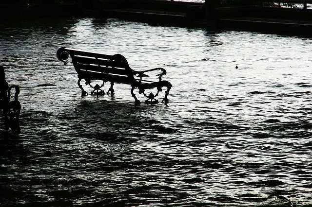 park bench in flood waters