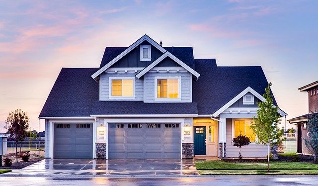 grey blue house with three car garage